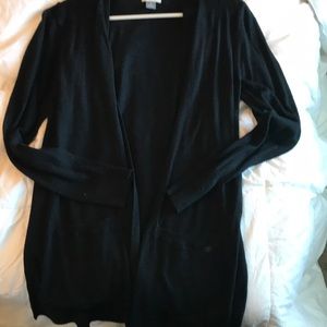 Black long cardigan with lower bottom pockets.